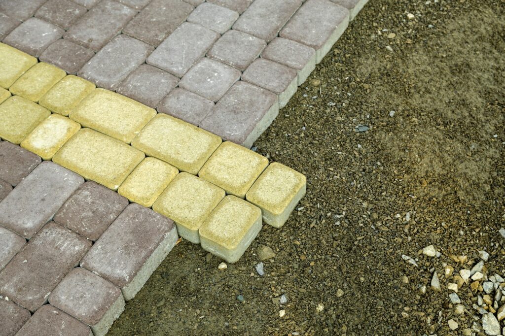 Installation of stone paving slabs in a yard